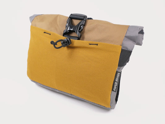 Bikepacking front harness quick access bag clip on shoulder bum bag hip pack waterproof roll top made in new zealand mustard grey