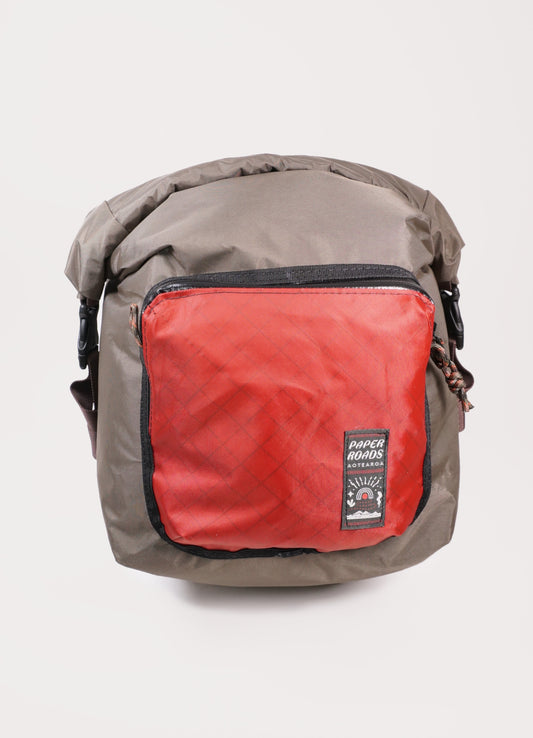 Bikepacking, bike touring, gravel cycling panniers with roll top and front pocket. Custom made in New Zealand.