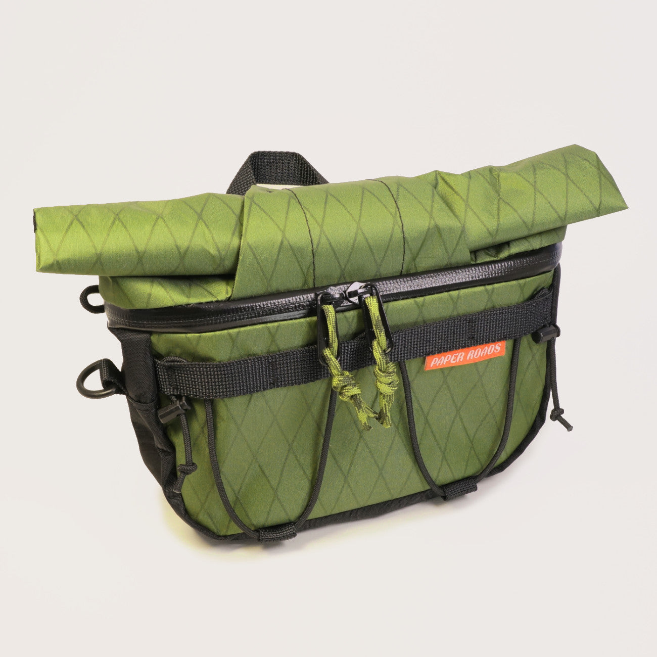 Hungry ranger bikepacking front roll accessory bag with roll top, front zip, shockcord. Compatible with harnesses and cradles. Made in NZ.