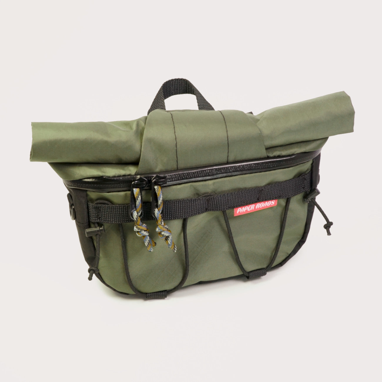 Hungry ranger bikepacking front roll accessory bag with roll top, front zip, shockcord. Compatible with harnesses and cradles. Made in NZ.