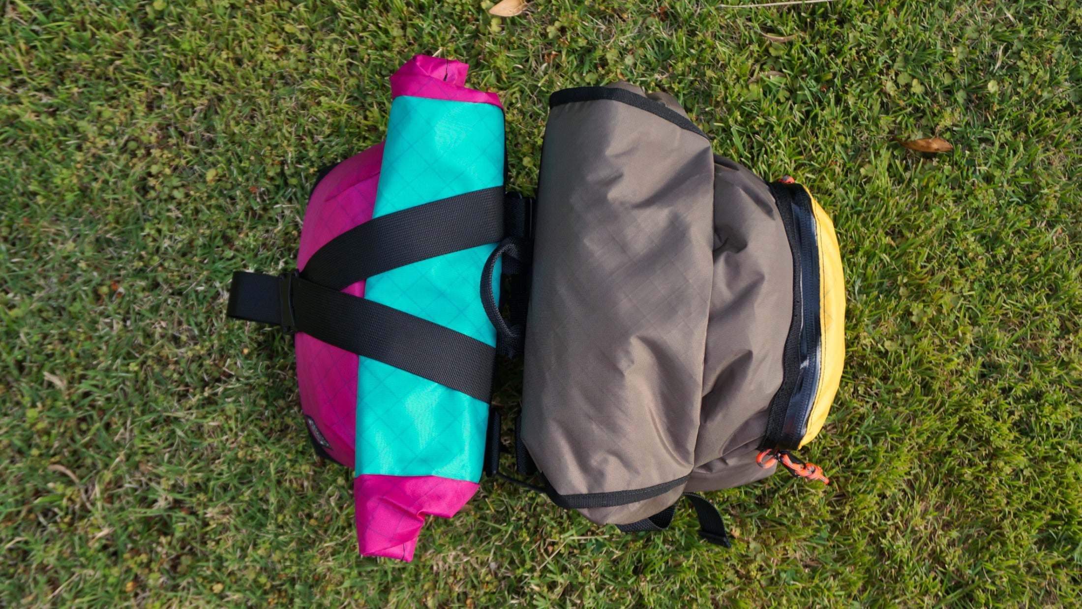 Bikepacking touring roll top panniers 8L and 12L. Custom handmade ultralight waterproof, sturdy for riding gravel and mountain bike trails. Made in New Zealand bike bags.