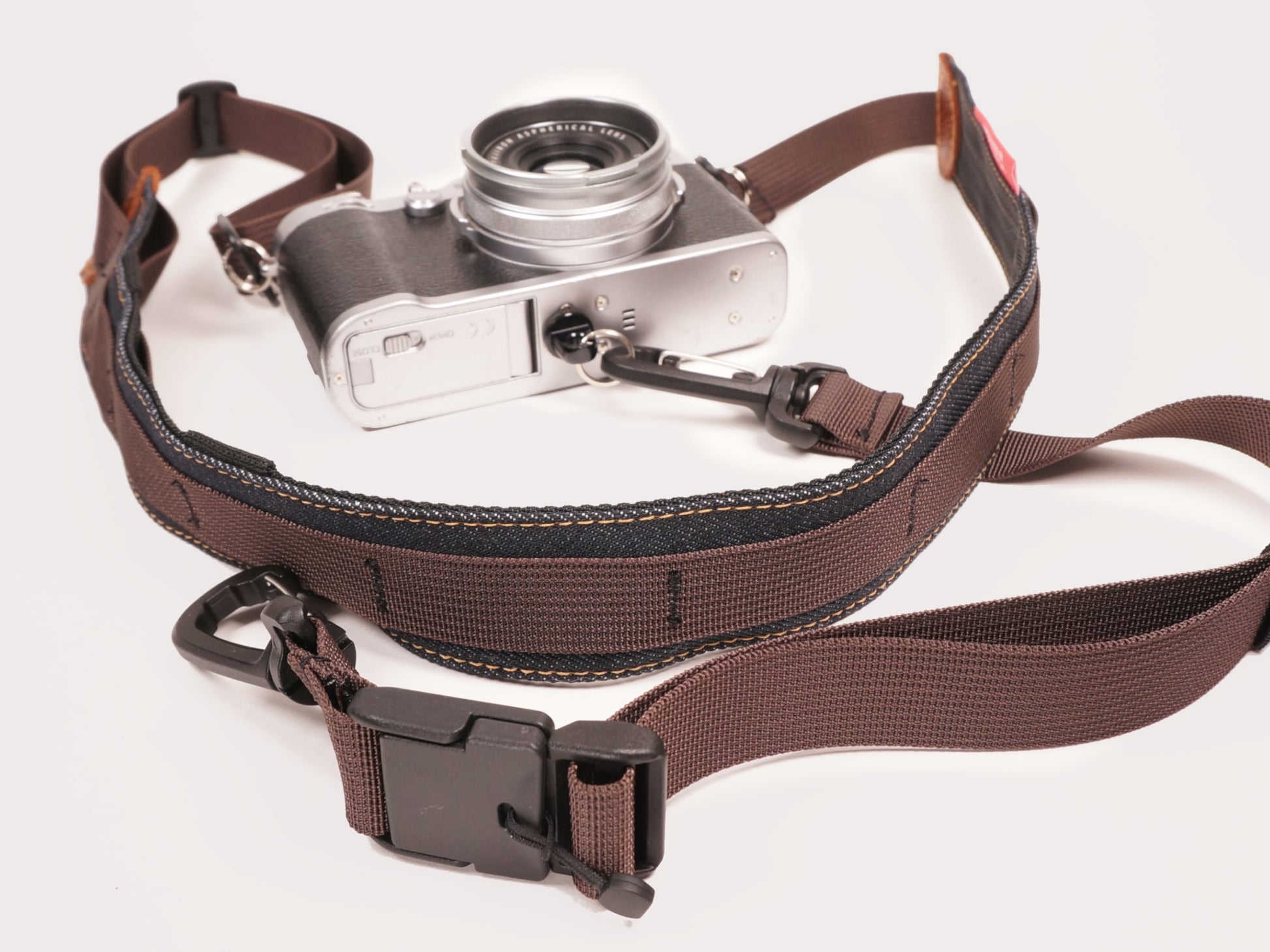 3 point camera strap, gravel road cycling, bikepacking, touring one handed photography. Magnet fidlock quick release buckle. Roskill Supplies collab, handmade in Auckland, New Zealand.