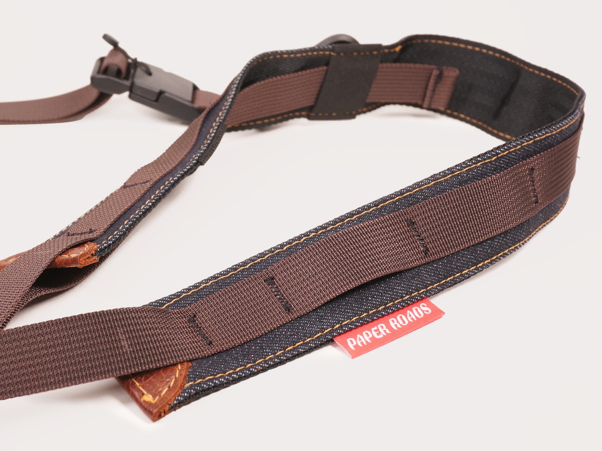 3 point camera strap, gravel road cycling, bikepacking, touring one handed photography. Magnet fidlock quick release buckle. Roskill Supplies collab, handmade in Auckland, New Zealand.