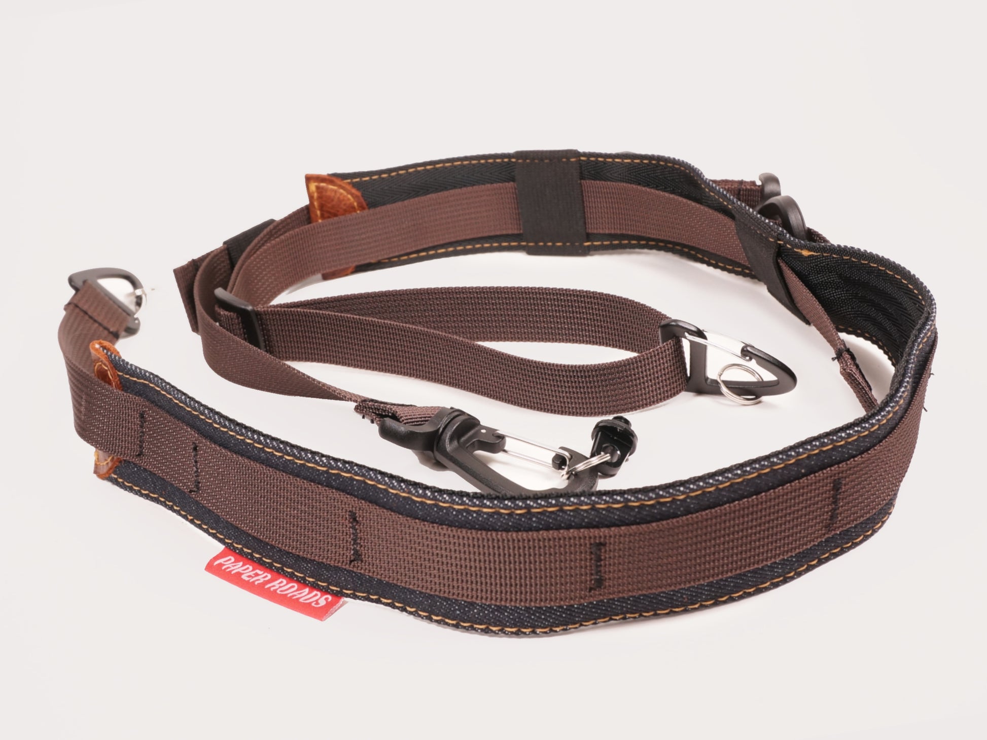 3 point camera strap, gravel road cycling, bikepacking, touring one handed photography. Magnet fidlock quick release buckle. Roskill Supplies collab, handmade in Auckland, New Zealand.