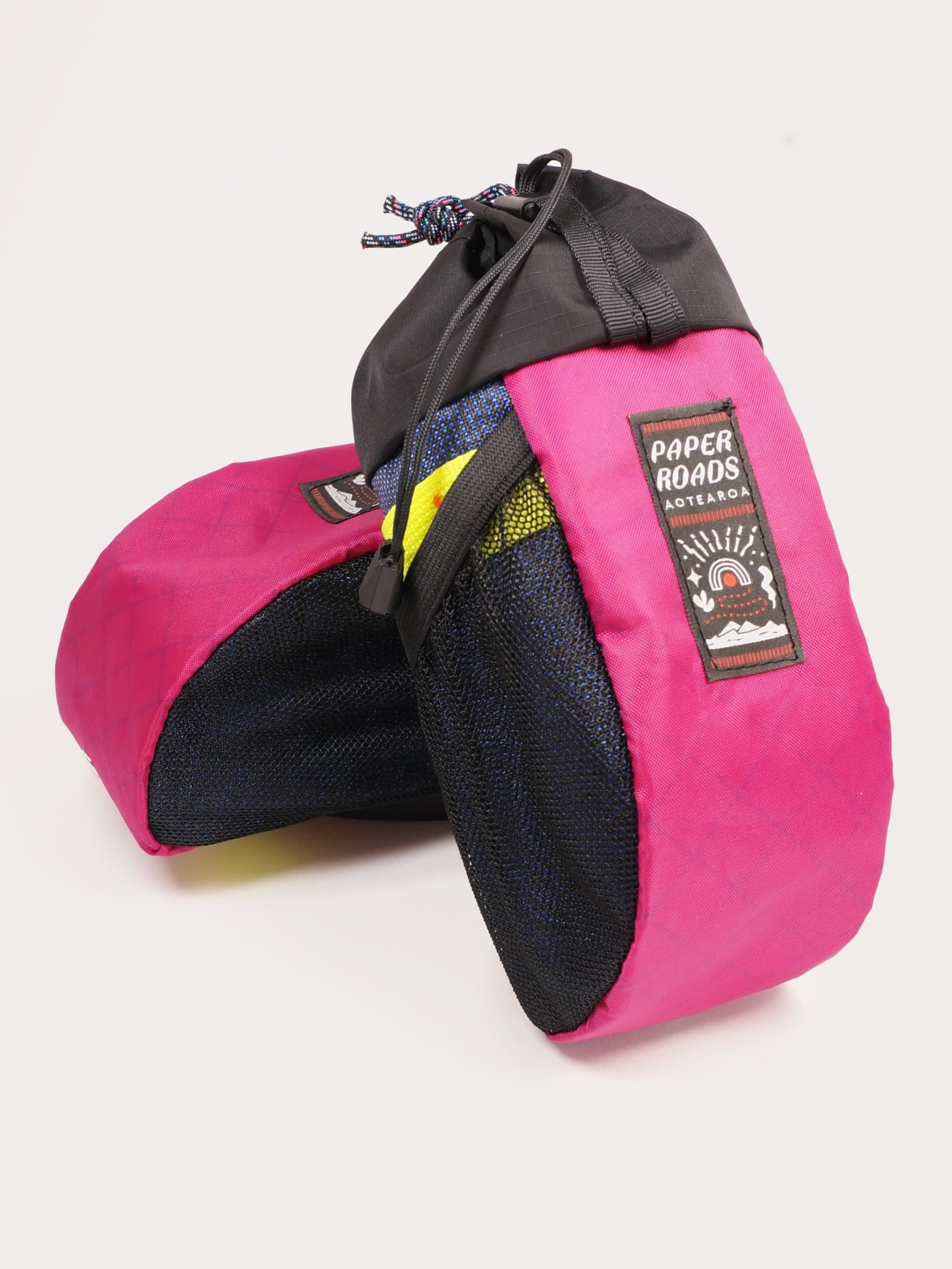 Large handlebar stem bag treat bag for cycling, commuting or bikepacking. Easy access to snacks or bottle, one handed opening. Brown with white top. Fuchsia or magenta, colourful bike bag. Made in New Zealand.