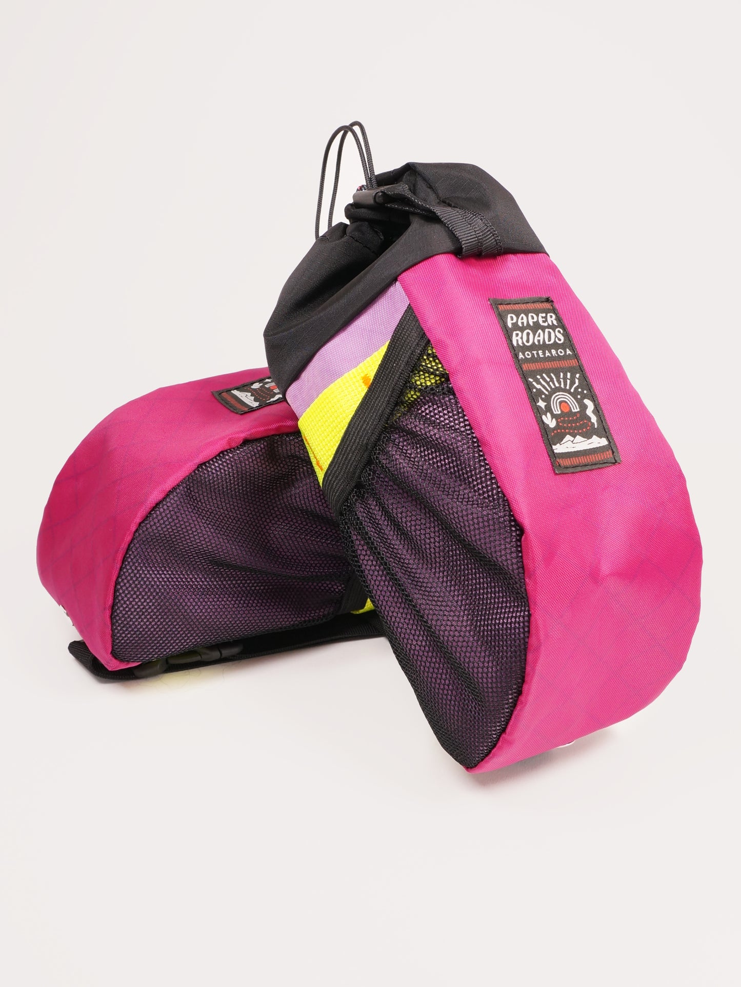 Large handlebar stem bag treat bag for cycling, commuting or bikepacking. Easy access to snacks or bottle, one handed opening. Brown with white top. Fuchsia or magenta, colourful bike bag. Made in New Zealand.