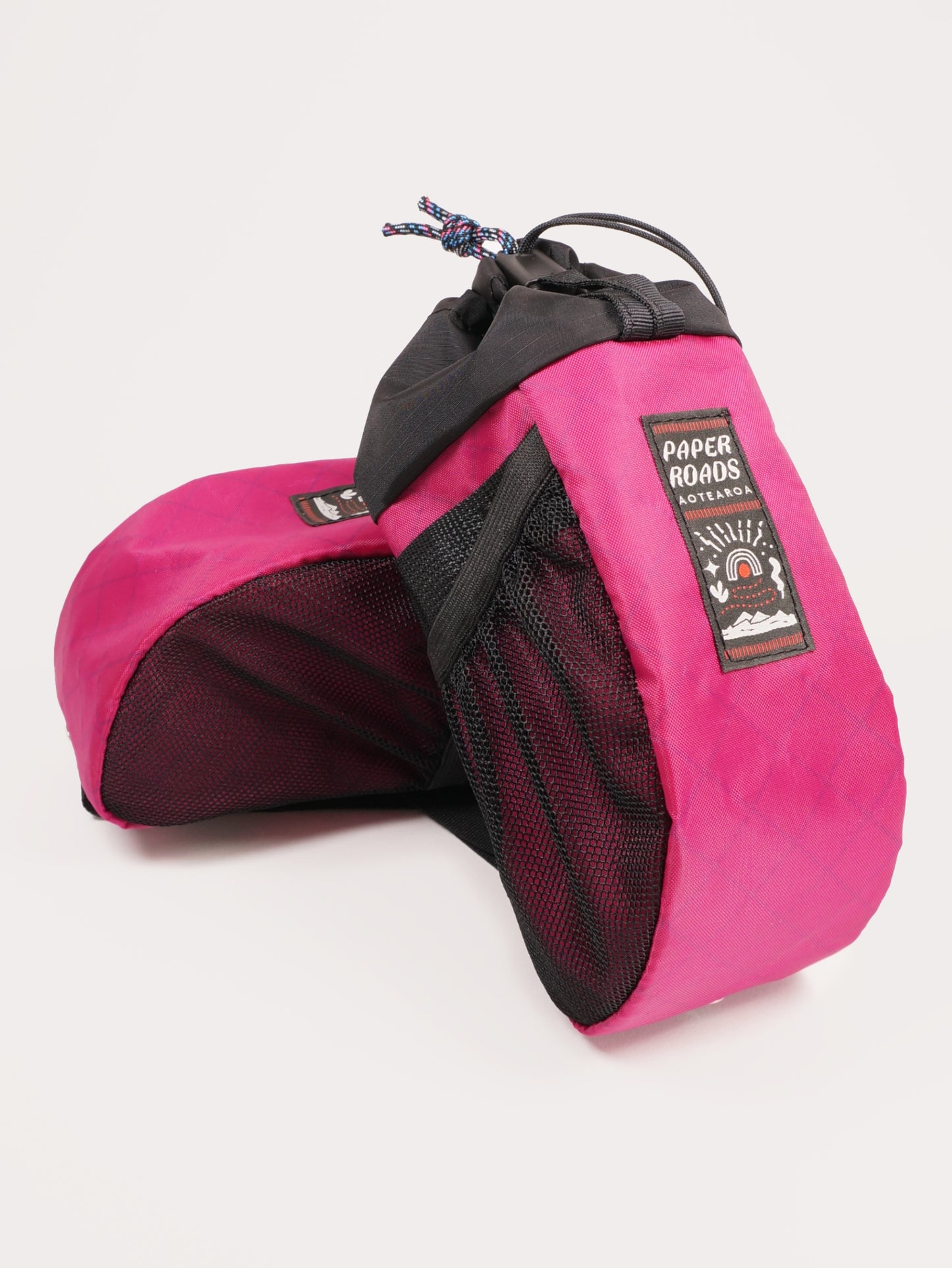 Large handlebar stem bag treat bag for cycling, commuting or bikepacking. Easy access to snacks or bottle, one handed opening. Brown with white top. Fuchsia or magenta, colourful bike bag. Made in New Zealand.
