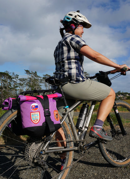 Bikepacking touring roll top panniers 8L. Custom handmade ultralight waterproof, sturdy for riding gravel and mountain bike trails. Made in Auckland, New Zealand bike bags. 