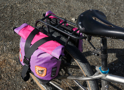 Bikepacking touring roll top panniers 8L. Custom colourful handmade ultralight waterproof, sturdy for riding gravel and mountain bike trails. Made in Auckland, New Zealand bike bags. 