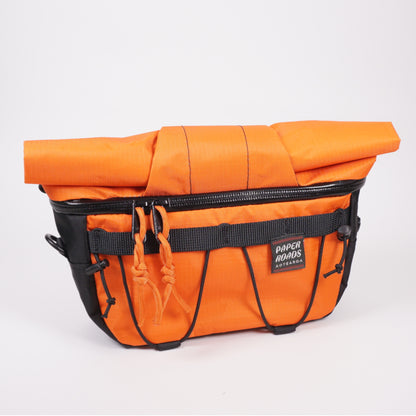 Bright easy access bike packing front roll bag in orange. Handmade in NZ.