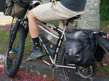 Bikepacking touring roll top panniers 12L. Custom handmade ultralight waterproof, sturdy for riding gravel and mountain bike trails. Made in Auckland, New Zealand bike bags. 