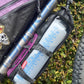 Mountain bike hydration system Nalgene bottle and drinking hose under bike frame for bikepacking, water bladder replacement.