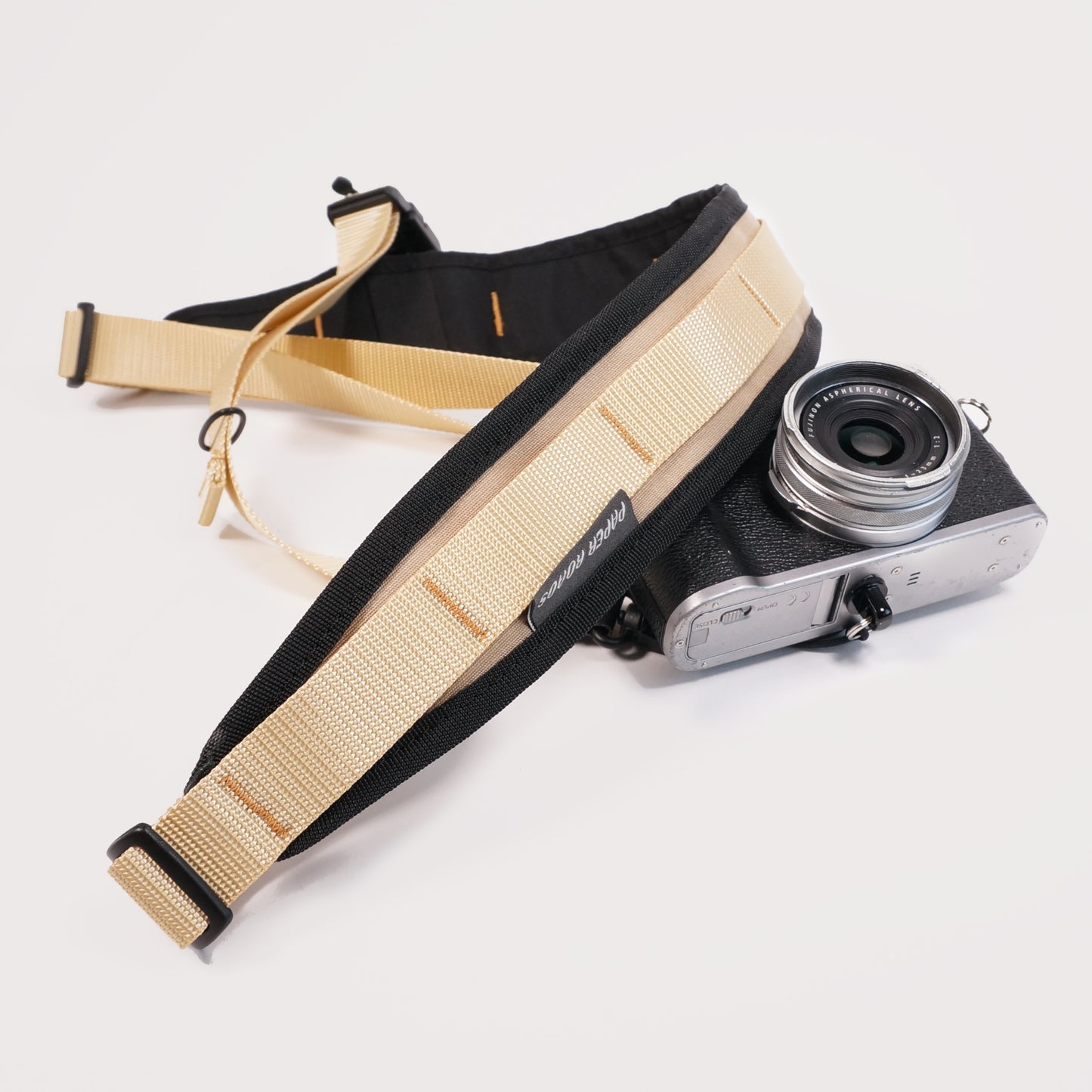cycling 3 point camera strap harness gravel bikepacking photography film shoot single handed. Paper Roads handmade new zealand colour beige cream