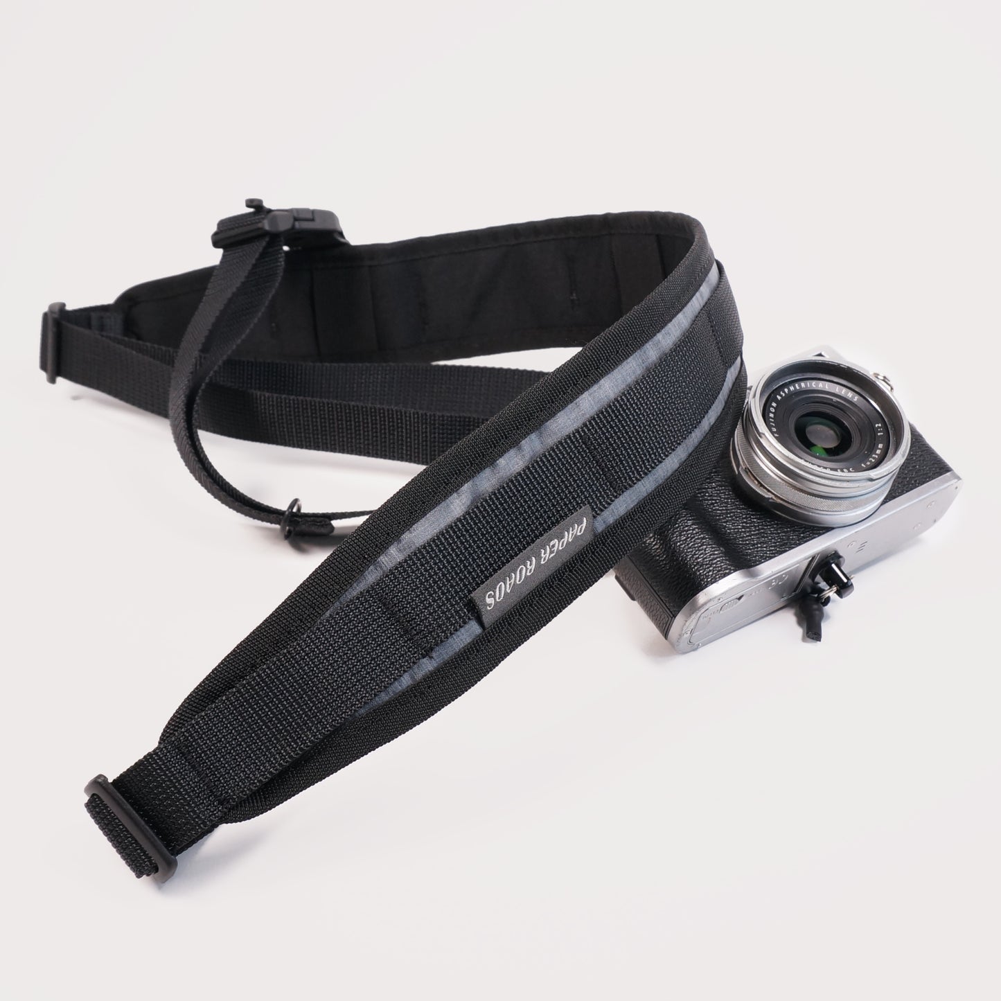 cycling 3 point camera strap harness gravel bikepacking photography film shoot single handed. Paper Roads handmade new zealand colour black grey