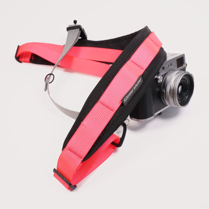cycling 3 point camera strap harness gravel bikepacking photography film shoot single handed. Paper Roads handmade new zealand colour pink grey rapha