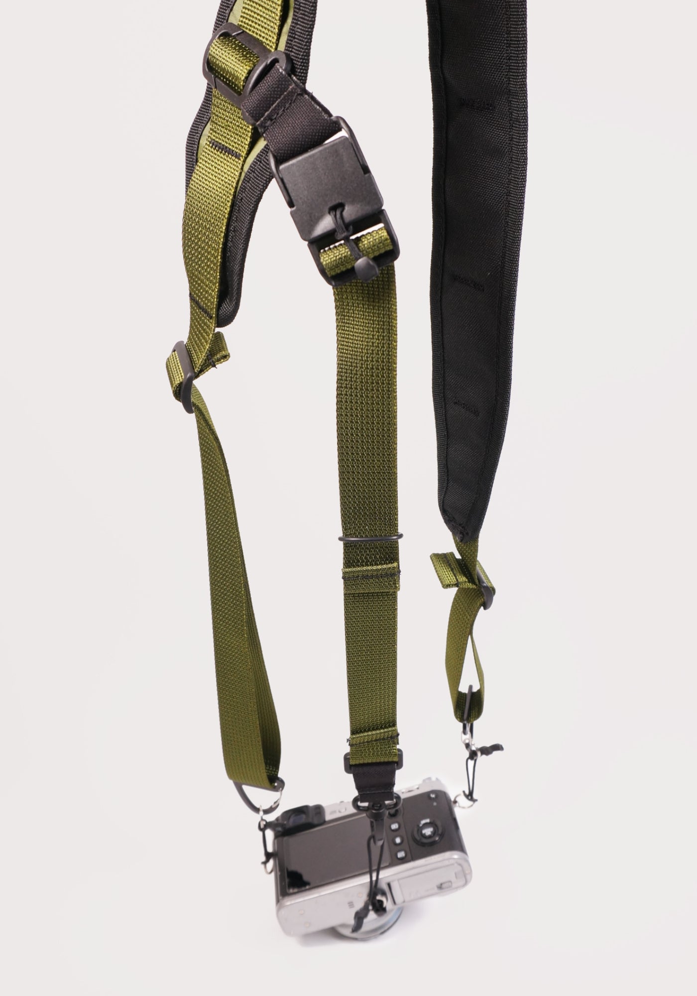 cycling 3 point camera strap harness gravel bikepacking photography film shoot single handed. Paper Roads handmade new zealand colour olive green