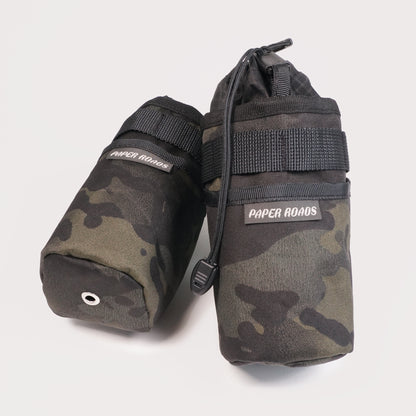 Bikepacking gravel cycling touring stem bags, treat bags, feed bags, handlebar snack bottle pouch. Paper Roads handmade in New Zealand. Colour - black multicam camo.
