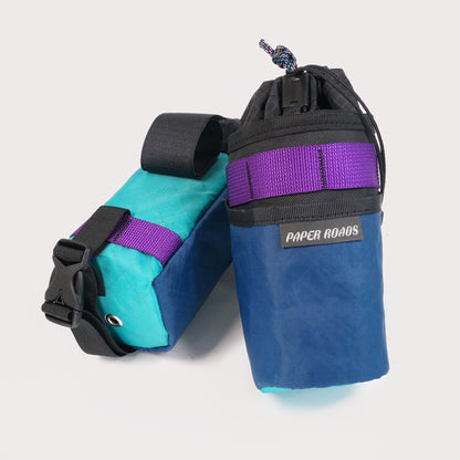 Bikepacking gravel cycling touring stem bags, treat bags, feed bags, handlebar snack bottle pouch. Paper Roads handmade in New Zealand. Colour - purple navy teal