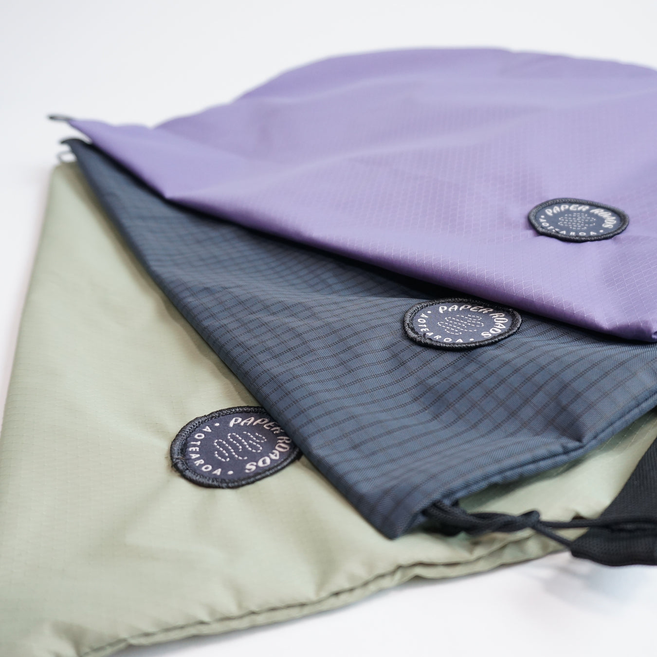Cycling biking bikepacking touring musette. Small packable shoulder bag for shopping or commuting. Made in New Zealand by Paper Roads Aotearoa. Colourful, souvenir, gift.