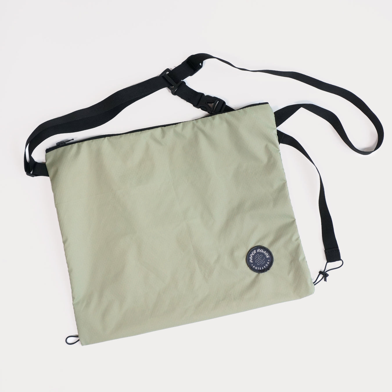 Cycling biking bikepacking touring musette. Small packable shoulder bag for shopping or commuting. Made in New Zealand by Paper Roads Aotearoa. Colourful, souvenir, gift. Moss colour.